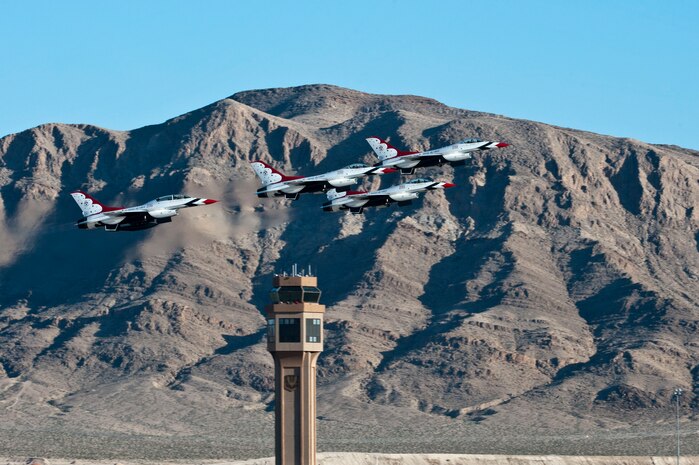 The United States Air Force Air Demonstration Squadron, Thunderbirds, take off during the annual Aviation Nation open house Nov. 11, 2012, at Nellis Air Force Base, Nev. The Thunderbirds are the fastest flying multiple jet flight demonstration team in the world. (U.S. Air Force photo by Airman 1st Class Jason Couillard)
