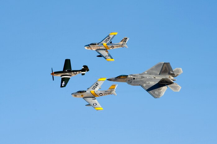 A United States Air Force Heritage Flight demonstration is performed during the annual Aviation Nation open house Nov. 11, 2012, at Nellis Air Force Base, Nev. The Heritage Flight presents the evolution of USAF air power by flying today's state-of-the-art fighter aircraft in close formation with vintage fighter aircraft. (U.S. Air Force photo by Airman 1st Class Christopher Tam)