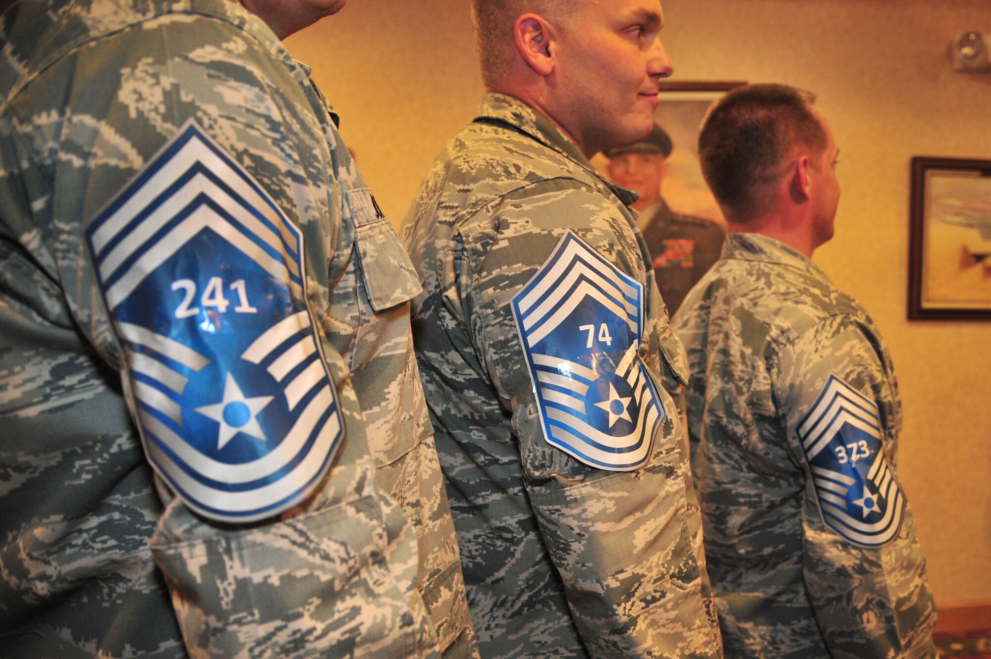 U.S. Air Force Senior Master Sgt. Timothy Jordan, 27th Special Operations Aircraft Maintenance Squadron, Senior Master Sgt. Anthony Steffen, 27th Special Operations Maintenance Squadron, and Senior Master Sgt. William Caton, 727th Special Operations Aircraft Maintenance Squadron, stand in the Landing Zone waiting to be formally announced as the newest Chief Master Sergeant selects at Cannon Air Force Base, N.M., Nov. 9, 2012. All three of Cannon?s newest chief selects came from the 27th Special Operations Maintenance Group and were honored at a party in the newly renovated Dagger Alley lounge. (U.S. Air Force photo/Airman 1st Class Alexxis Pons Abascal)  