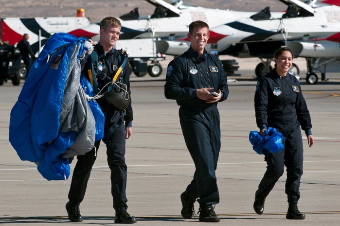 Cadets 1st Class Joshua Mills, Sam Raine, and Pia Goodman, Wings of Blue demonstration team, complete a successful jump during the annual Aviation Nation open house Nov.11, 2012, at Nellis Air Force Base, Nev. The Wings of Blue demonstration team is based at the U.S. Air Force Academy in Colorado Springs, Colo. (U.S. Air Force photo by Airman 1st Class Jason Couillard)