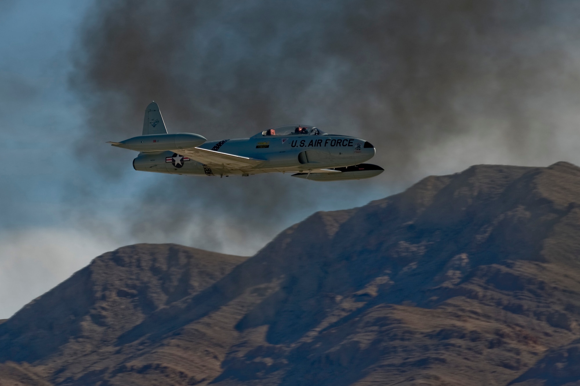 A T-33 Shooting Star performs a Korean Conflict reenactment during the annual 2012 Aviation Nation open house Nov. 10, 2012 at Nellis Air Force Base, Nev. The T-33 Shooting Star, produced by Lockheed, made its first flight in 1948. (U.S. Air Force Photo By Senior Airman Daniel Hughes) 