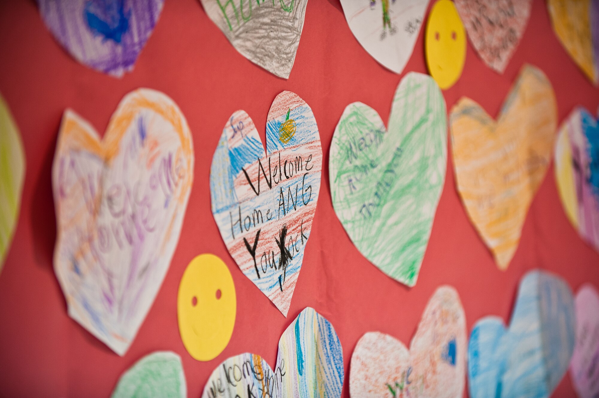 Colorful hearts, made by children at Crums Lane Elementary School in Louisville, Ky., provide a cheerful welcome for 58 Airmen from the 123rd Airlift Wing who returned to Louisville Nov. 10, 2012, after a four-month deployment to the Persian Gulf. The Airmen, all members of the Kentucky Air National Guard, flew daily airlift missions in support of U.S. military operations across the U.S. Central Command Area of Responsibility, which includes Iraq, Afghanistan and Northern Africa. (U.S. Air Force photo by Maj. Dale Greer)