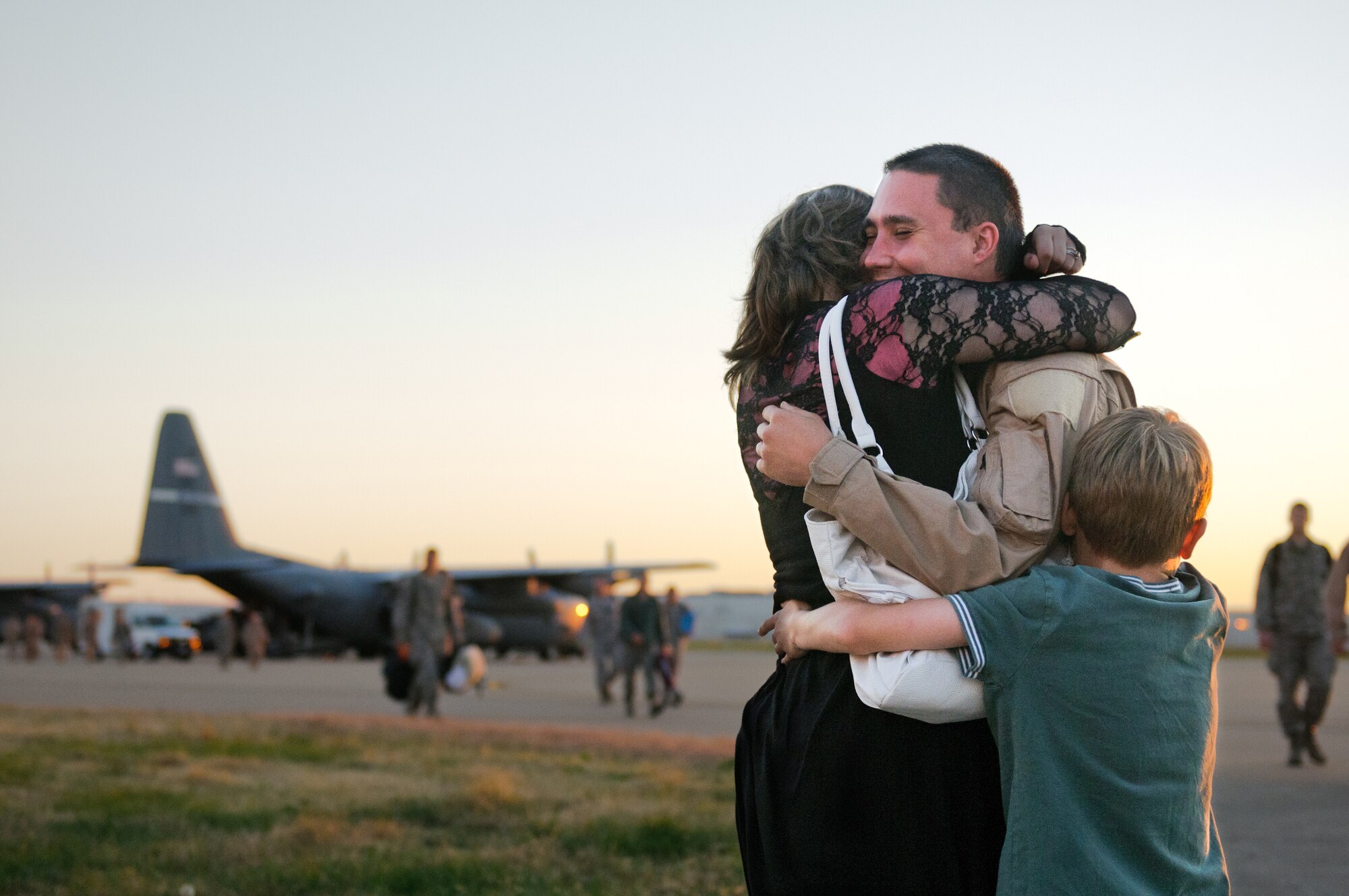 A member of the 123rd Airlift Wing gets a welcome-home hug from loved ones Nov. 10, 2012, at the Kentucky Air National Guard Base in Louisville, Ky. The Airman was one of 58 Kentucky Guardsmen returning from a four-month deployment to the Persian Gulf. (U.S. Air Force photo by Master Sgt. Phil Speck)