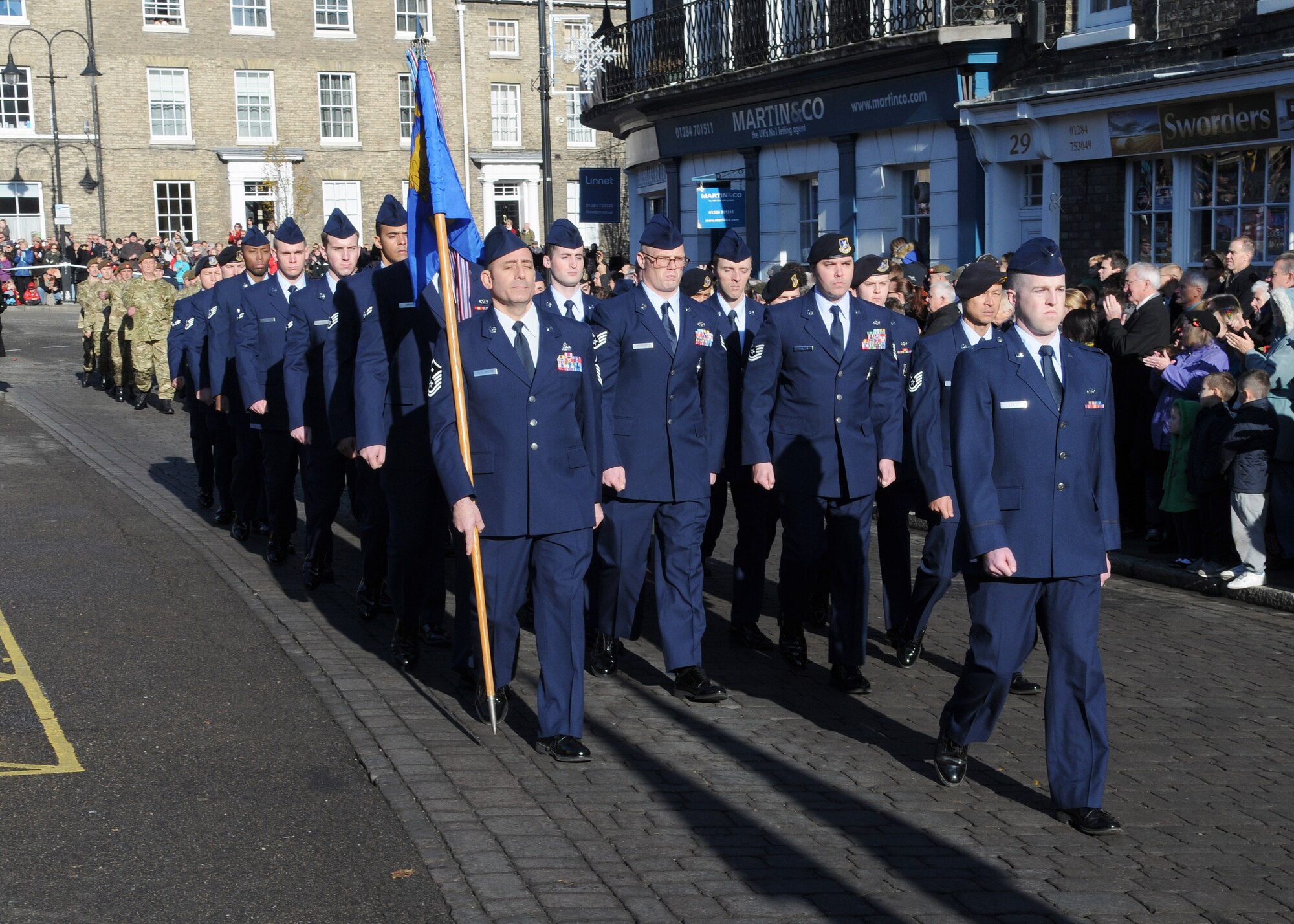 U.S. Airmen from RAF Mildenhall march in a Remembrance Day parade Nov. 11, 2012, in Bury St. Edmunds, England. The parade consisted of participants from the Royal Air Force, U.S. Airmen from RAF Mildenhall, civic leaders, military cadets and others. (U.S. Air Force photo by Staff Sgt. Tabitha M. Lee/Released)