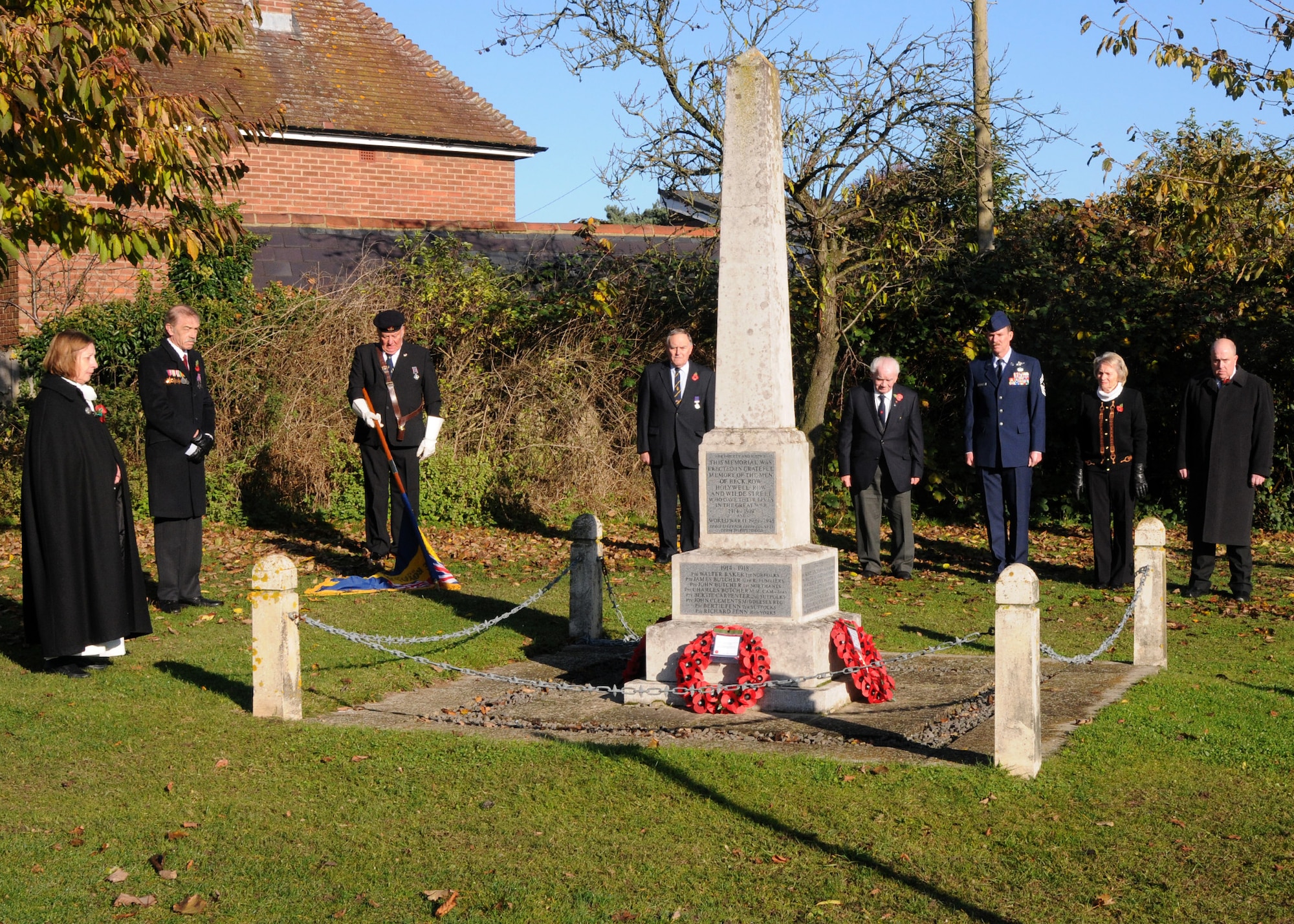 Chief Master Sgt. Christopher Powell, 100th Air Refueling Wing command chief, stands with members of the Royal British Legion Lakenheath Chapter, during a Remembrance Day wreath-laying ceremony Nov. 11, 2012, in Beck Row, England. Remembrance Day is held on Nov. 11 every year as a way to pay respect to military members who lost their lives. (U.S. Air Force Photo by Airman 1st Class Kelsey Waters/Released)