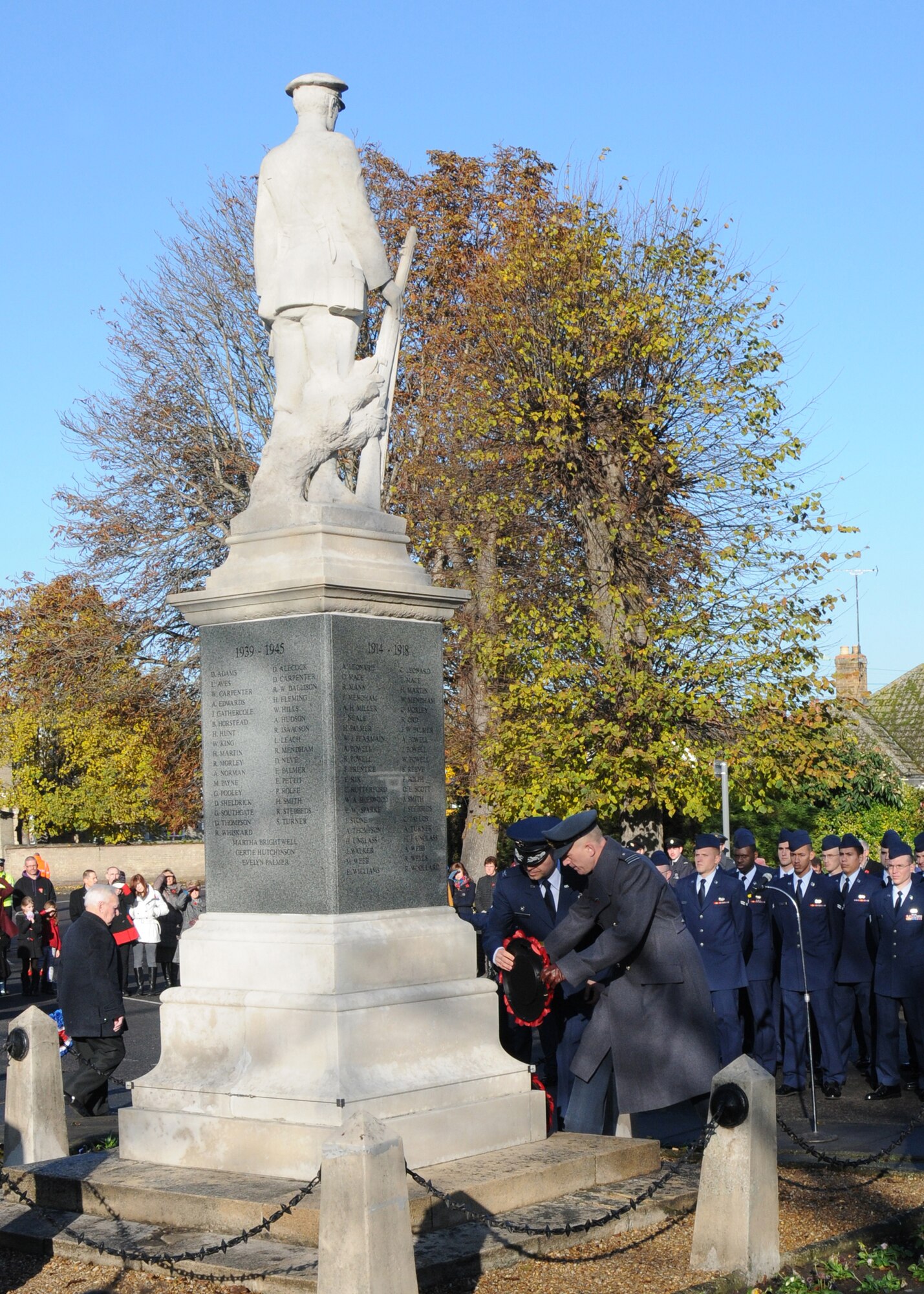 Royal Air Force Sq. Ldr. Richard Fryer, right, the RAF commander of RAF Mildenhall, and U.S. Air Force Col. Joseph Rushlau, 100th Maintenance Group commander, lay a wreath during a Remembrance Day ceremony Nov. 11, 2012, at Mildenhall, England. Remembrance Day is held in November each year to honor members of the armed forces who have lost their lives in the line of duty. (U.S. Air Force photo by Tech. Sgt. Neal X. Joiner/Released)