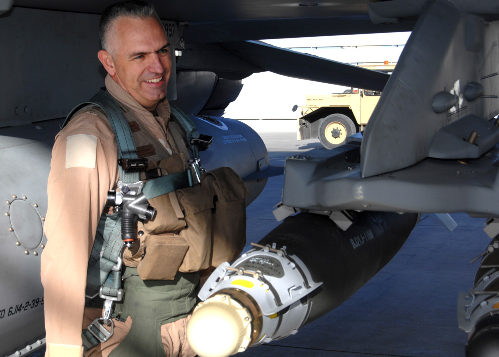 U.S. Air Force Brig. Gen. Scott Dennis, 451st Air Expeditionary Wing and Kandahar Airfield Commander, performs a pre-flight inspection before a sortie on Nov. 8. The general, an F-16 fighter pilot who has flown more than 60 combat missions here during the past year, relinquishes command at the end of the month. (U.S. Air Force photo/Master Sgt. Russell Martin) 