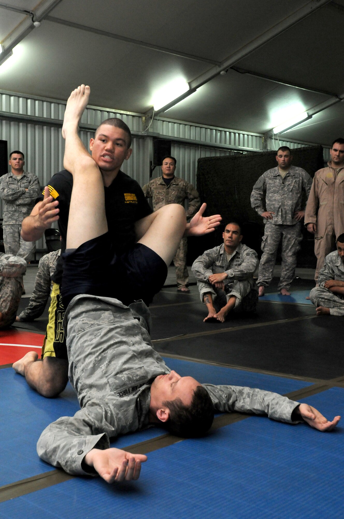 SOUTHWEST ASIA -- U.S. Army 1st Lt. Christian Pierce, from the 1st Battalion, 7th Air Defense Artillery Regiment, explains grappling techniques during a combatives class Nov. 6, 2012. Pierce, an Athens, Ga., native, is deployed from Fort Bragg, N.C. (U.S. Air Force photo/Tech. Sgt. Amanda Savannah) 