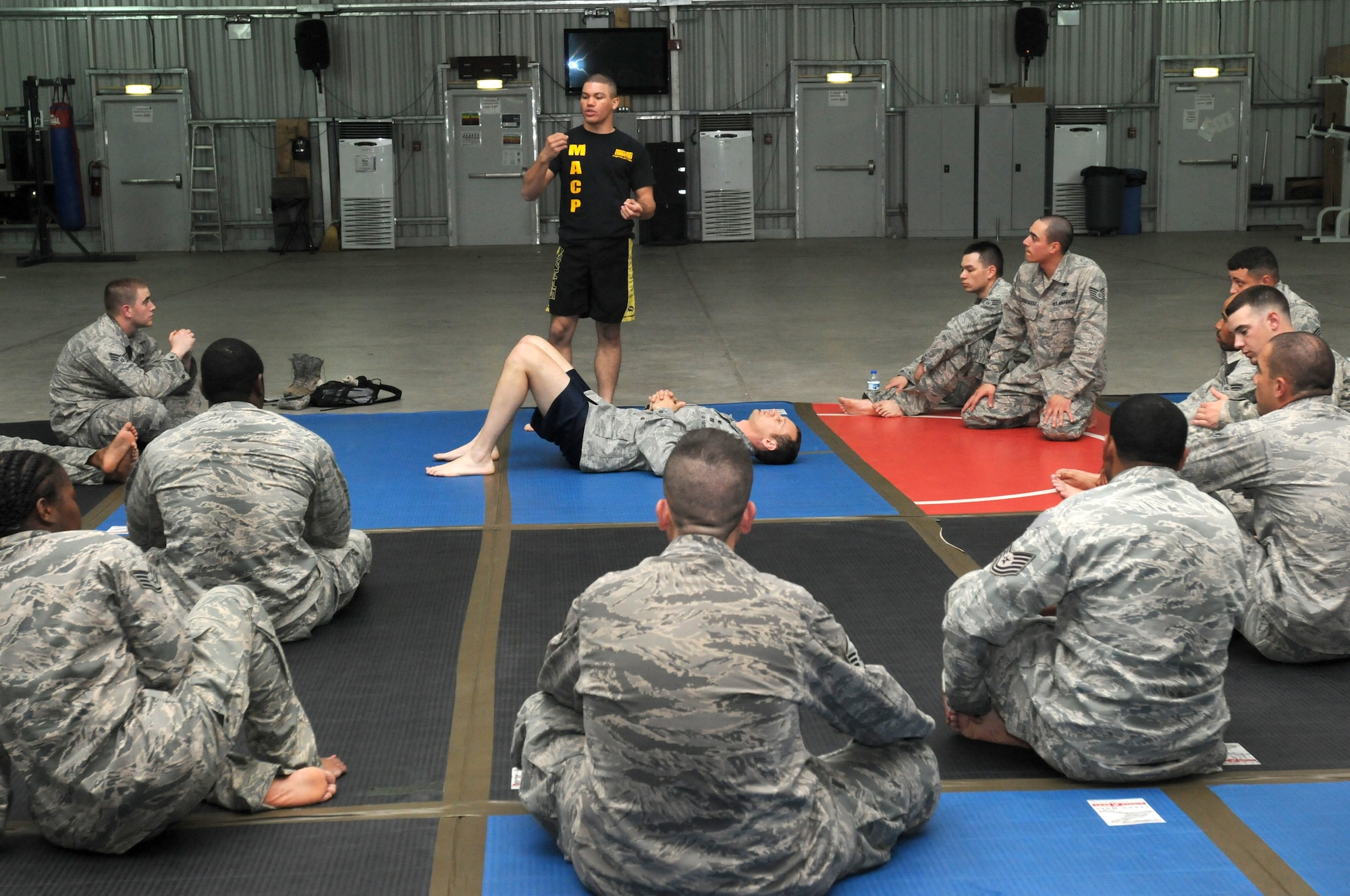SOUTHWEST ASIA -- U.S. Army 1st Lt. Christian Pierce, from the 1st Battalion, 7th Air Defense Artillery Regiment, leads a basic combatives class Nov. 6, 2012. Pierce and Sgt. Derrick Kistler are instructing 380th Air Expeditionary Wing members in Army level one combatives techniques. (U.S. Air Force photo/Tech. Sgt. Amanda Savannah) 