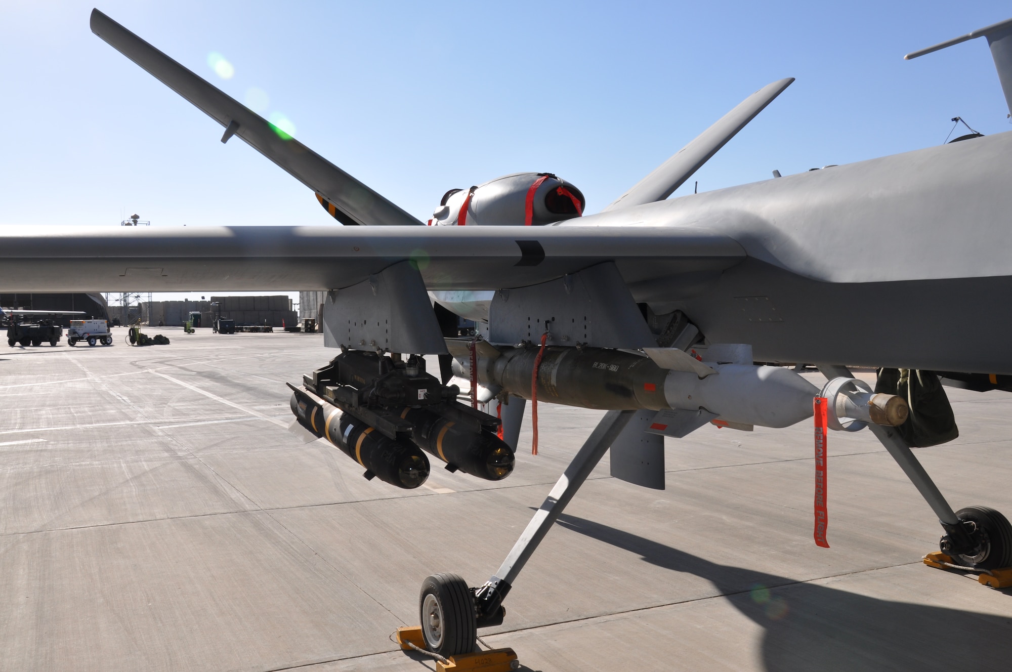 An MQ-9 Reaper at Kandahar Airfield is loaded with AGM-114 Hellfire missiles and a 500-pound GBU-12. The Reaper, maintained by the 451st Expeditionary Aircraft Maintenance Squadron here, is a Remotely Piloted Aircraft. Its primary mission is to hunt and kill the enemy. (U.S. Air Force photo/Capt. Tristan Hinderliter) 