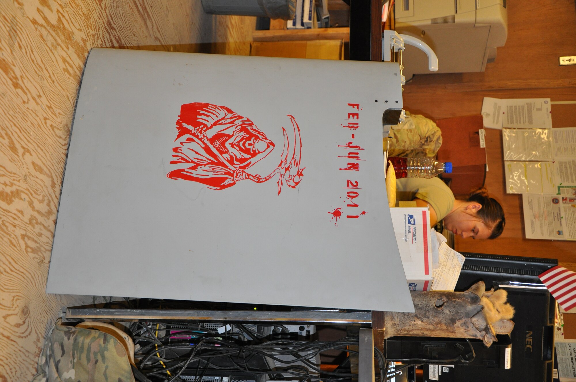 Airman First Class Casey Spencer is a debriefer with the MQ-9 Aircraft Maintenance Unit, 451st Expeditionary Aircraft Maintenance Squadron at Kandahar Airfield. When the aircraft land, the operators bring aircraft forms to Spencer and debrief how the aircraft flew. She then inputs that data into the unit’s online maintenance database that gets tracked as part of the aircraft history. (U.S. Air Force photo/Capt. Tristan Hinderliter) 