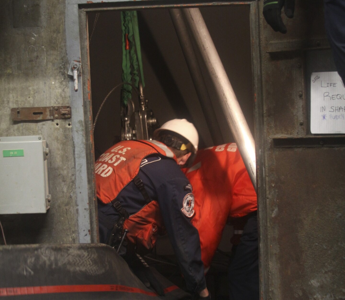 Coast Guardsmen with the Deployable Operations Group hook up additional pumps at the Brooklyn Battery Tunnel ventilation facility on Governor’s Island. The groups is assisting with the dewatering efforts in New York after hurricane Sandy. 