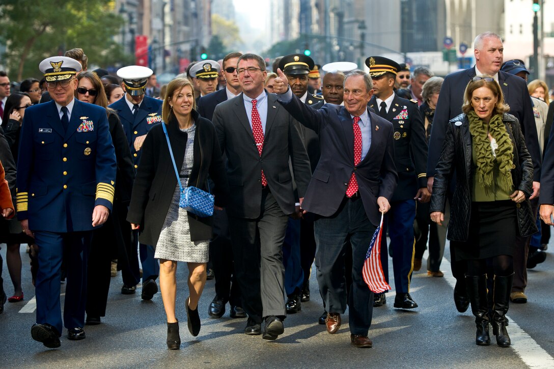 Deputy Defense Secretary Ashton B. Carter, his wife, Stephanie, and New York City Mayor Michael R. Bloomberg march in the Veterans Day Parade, in New York, Nov. 11, 2012. 