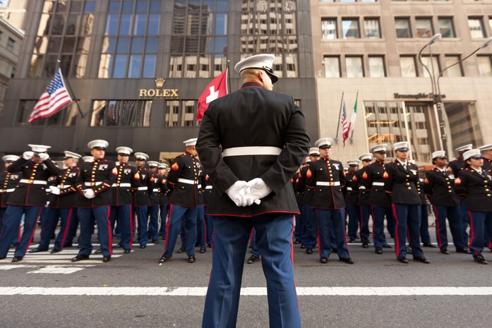 NEW YORK -- A Marine from 6th Communications Battalion, Marine Forces Reserve, paused his formation as they marched in the annual New York Veterans Day parade, here, Nov. 11.  The parade is hosted by the United War Veterans Council, Inc. on behalf of the City of New York. It is the oldest and largest of its kind in the nation. Since November 11, 1919, the parade has provided an opportunity for Americans and International visitors to honor those who have served in the nation’s largest city. (Official Marine Corps photo by Bryan Nygaard)