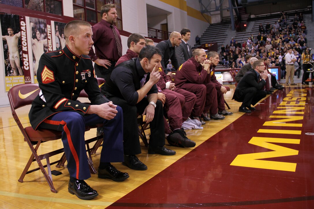 Rochester, Minn., recruiter Sgt. Landon Dahmes represents Recruiting Station Twin Cities as the Warrior of the Match during University of Minnesota's wrestling home-opener against number 25 ranked Hofstra at the Sports Pavilion on Nov. 9. Dahmes, 26, from Shoreview, Minn., sat with the number one ranked Gophers and oversaw the coin toss at the beginning of the bout. 
