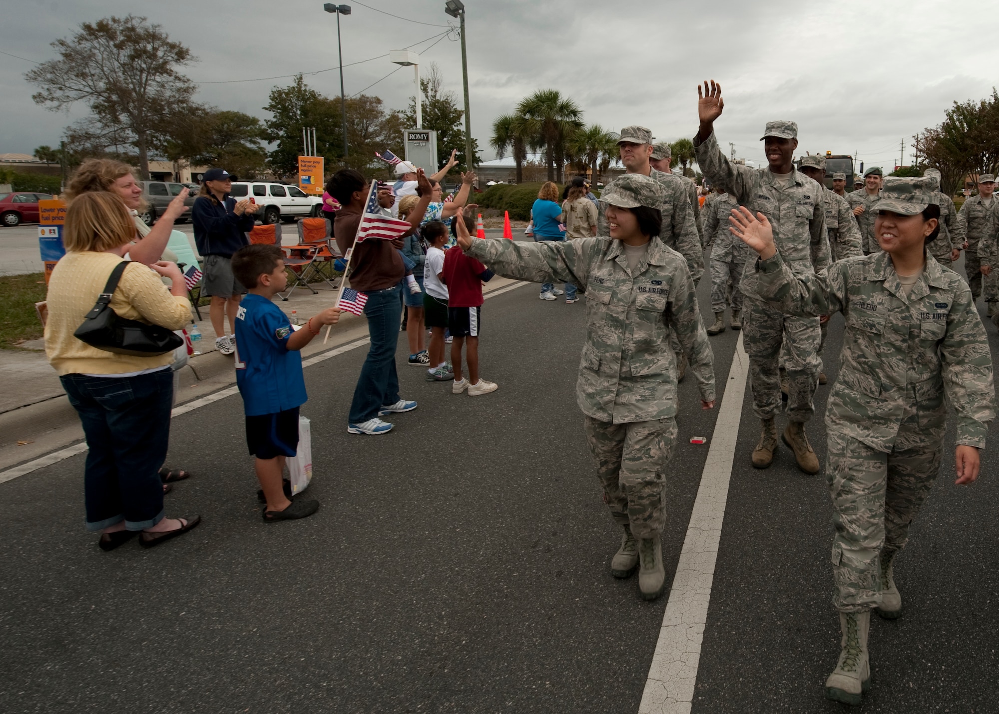 United States Air Force Airmen wave to attendees of the Veteran's Day Parade in at the Santa Rosa mall in Mary Esther, Fla., Nov. 12, 2012. Military members at  participated in the Veteran's Day Parade to honor veterans of the present and past. (U.S. Air Force photo / Airman 1st Class Nigel Sandridge)
