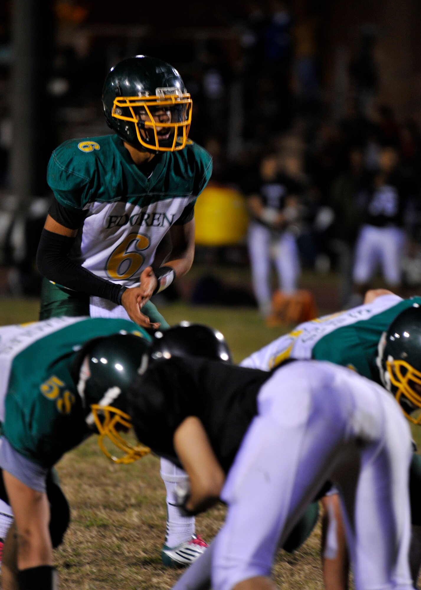 Edgren Eagles quarterback Tristan Jefferson awaits the snap from center during the Division II championship game at Camp Zama, Japan, Nov. 10, 2012. Jefferson was held to 73 all-purpose yards by the Zama Trojans, who won the game 35-20. (U.S. Air Force photo by Airman 1st Class Zachary Kee)