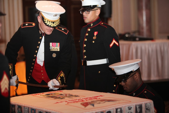 Marine Corps Forces Central Command Deputy Commanding General, BGen. Gregg P. Olson, cuts into the traditional birthday cake during the 237th Marine Corps Birthday Ball Celebration. The birthday cake is traditionally cut with the Mameluke sword, as a reminder that we are a band of warriors, committed to carrying the sword, so that our nation may live in peace.