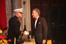 Marine Corps Forces Central Command Deputy Commanding General, BGen. Gregg P. Olson, shakes hands with the U.S. Ambassador to the Kingdom of Bahrain, Thomas Krajeski, who attended as the guest of honor at the MARCENT 237th Birthday Ball Celebration in the Middle East, Nov 9. 