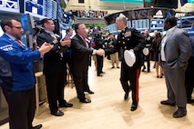 NEW YORK, NY - NOVEMBER 12:  United States Marine Corps Major General Michael G. Dana, and Members of the U.S. Armed Forces, ring the opening bell to Commemorate Veterans Day at the New York Stock Exchange on October 12, 2012 in New York City. (Photo by Dario Cantatore/NYSE Euronext)