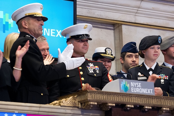 NEW YORK, NY - NOVEMBER 12:  United States Marine Corps Major General Michael G. Dana, and Members of the U.S. Armed Forces, ring the opening bell to Commemorate Veterans Day at the New York Stock Exchange on October 12, 2012 in New York City. (Photo by Dario Cantatore/NYSE Euronext)