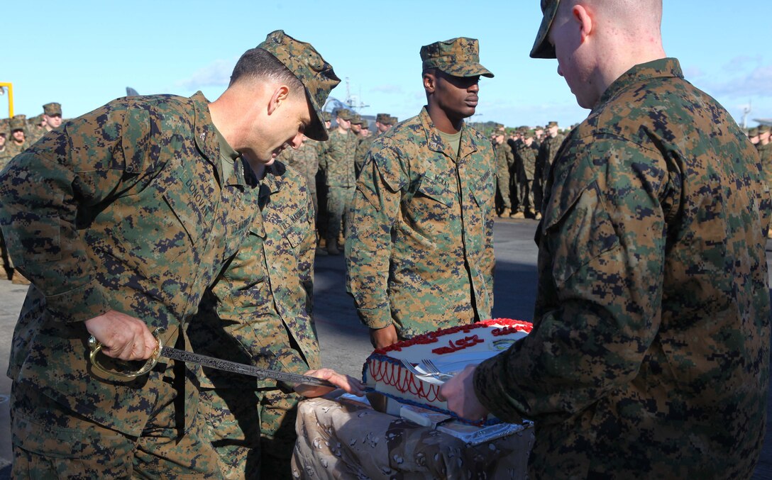 USS IWO JIMA, NAVAL STATION ROTA (Nov. 11, 2012) - Col. Frank Donovan, commanding officer, 24th Marine Expeditionary Unit, cuts the traditional birthday cake to be presented to the oldest and youngest Marines during the 237th Marine Corps birthday ceremony aboard USS Iwo Jima Nov. 11, 2012.  The 24th MEU is deployed with the Iwo Jima Amphibious Ready Group and is currently in the 6th Fleet Area of Responsibility as a disaster relief and crisis response force. Since deploying in March, they have supported a variety of missions in the U.S. Central and European Commands, assisted the Navy in safeguarding sea lanes, and conducted various bilateral and unilateral training events in several countries in the Middle East and Africa. The 24th MEU is scheduled to return to their home bases in North Carolina later this year. (U.S. Marine Corps photo by Gunnery Sgt. Chad R. Kiehl/Released)