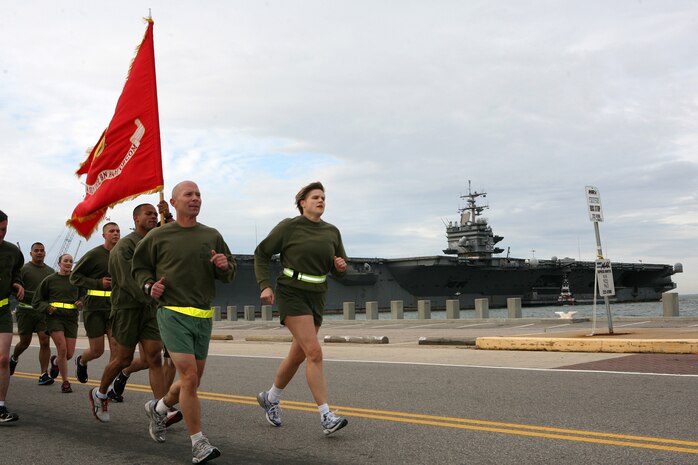 NORFOLK (Nov. 8, 2012) - Col. Susan Seaman, commanding officer, Headquarters and Service Battalion, Marine Forces Command and Sgt. Maj. Scott Helms, lead a formation run along the peir of Naval Station Norfolk to commemorate the 237th Marine Corps Birthday.