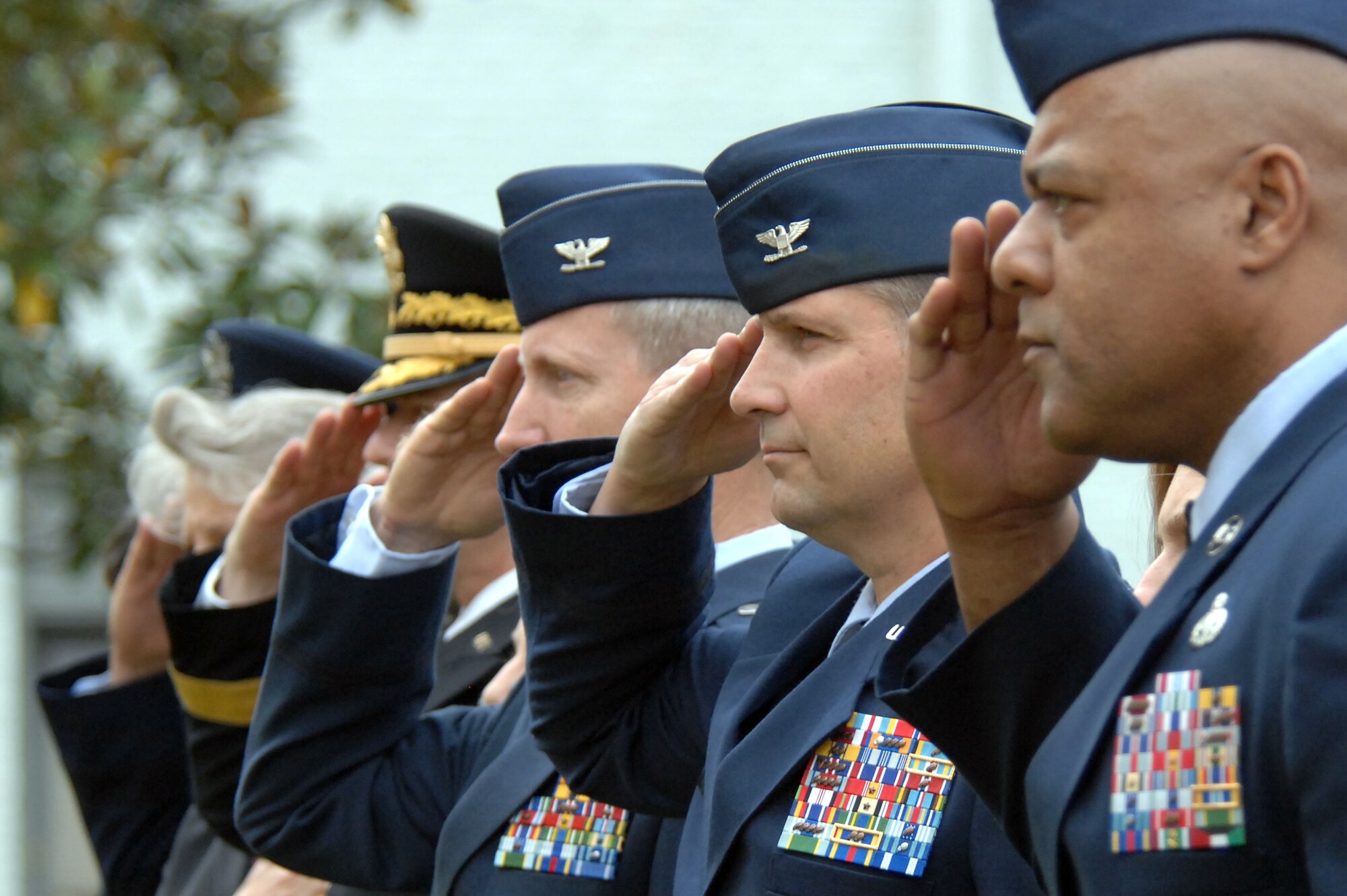 (From right) Chief Master Sgt. James Wilkerson, 20th Fighter Wing command chief, Col. Clay Hall, 20th FW commander, and other leaders from Team Shaw render a salute during the national anthem at the Sumter Veterans Day Celebration, held at the Sumter County Court House, Sumter, S.C., Nov. 12, 2012.  (U.S. Air Force photo by Staff Sgt. Ave I. Young/Released)