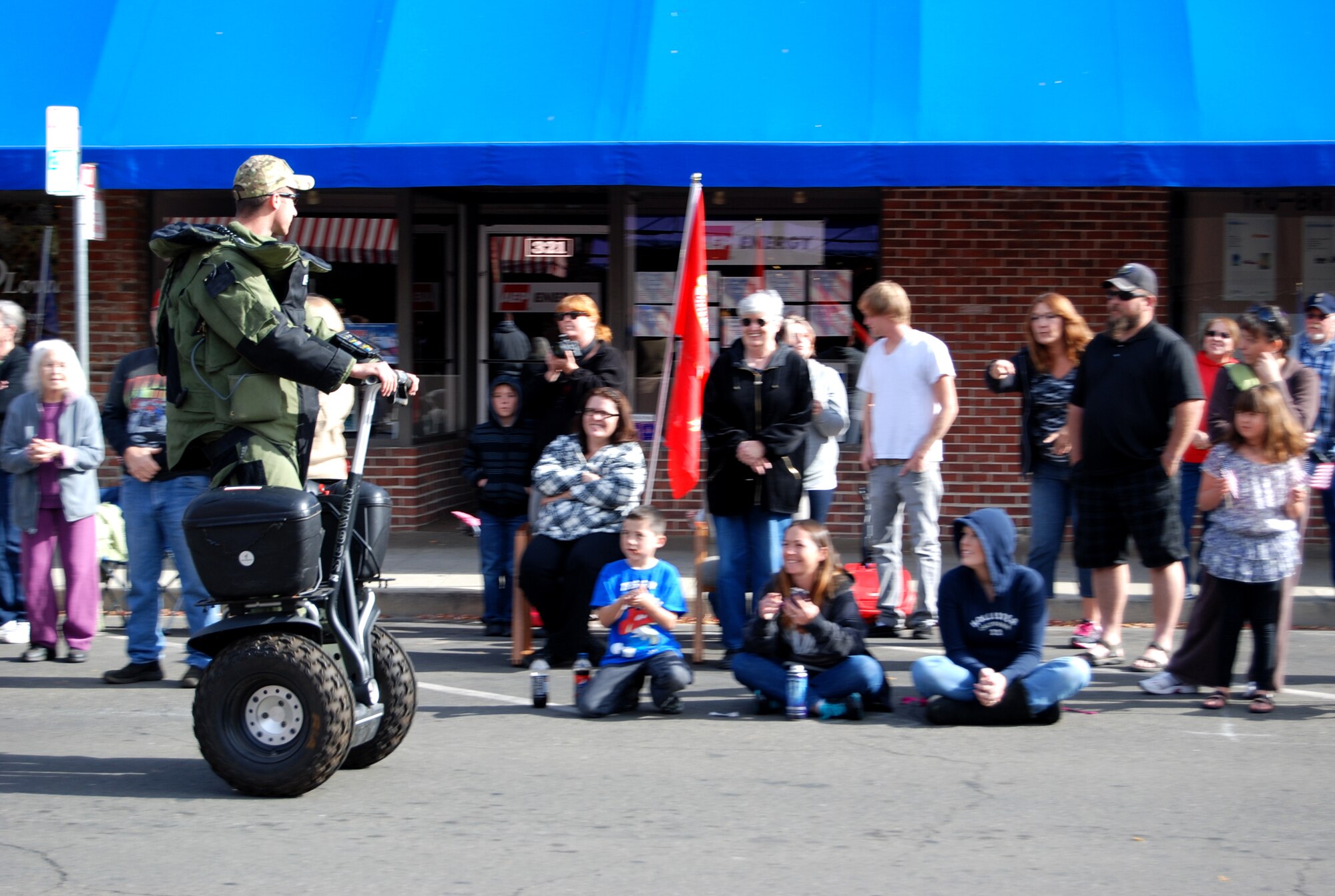 A member of the 9th Civil Engineer Squadron Explosive Ordinance Disposal Flight rides a Segway along the parade route during the Yuba-Sutter Veterans Day Parade in Marysville, Calif., Nov. 11, 2012. More than 400 Team Beale Airmen participated in the parade. (U.S. Air Force photo by Capt. Brian Wagner/Released)