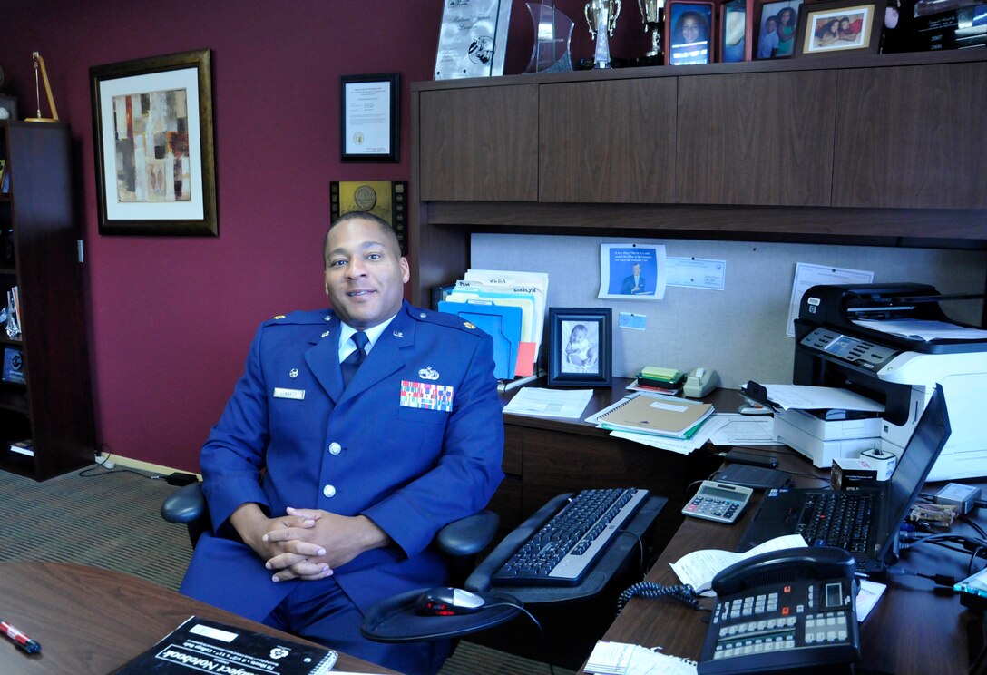 Major Tony Edwards, 86th Aerial Port Squadron commander, out of McChord Field, Wash., in his State Farm Insurance office in Everett, Wash., Nov. 9, 2012. Edwards recently earned his second Bronze Star for his actions in closing down Kirkuk Regional Air Base, Iraq in 2011. He received his first Bronze Star after his deployment in Afghanistan in 2008. (U.S. Air Force photo by Master Sgt. Jake Chappelle)