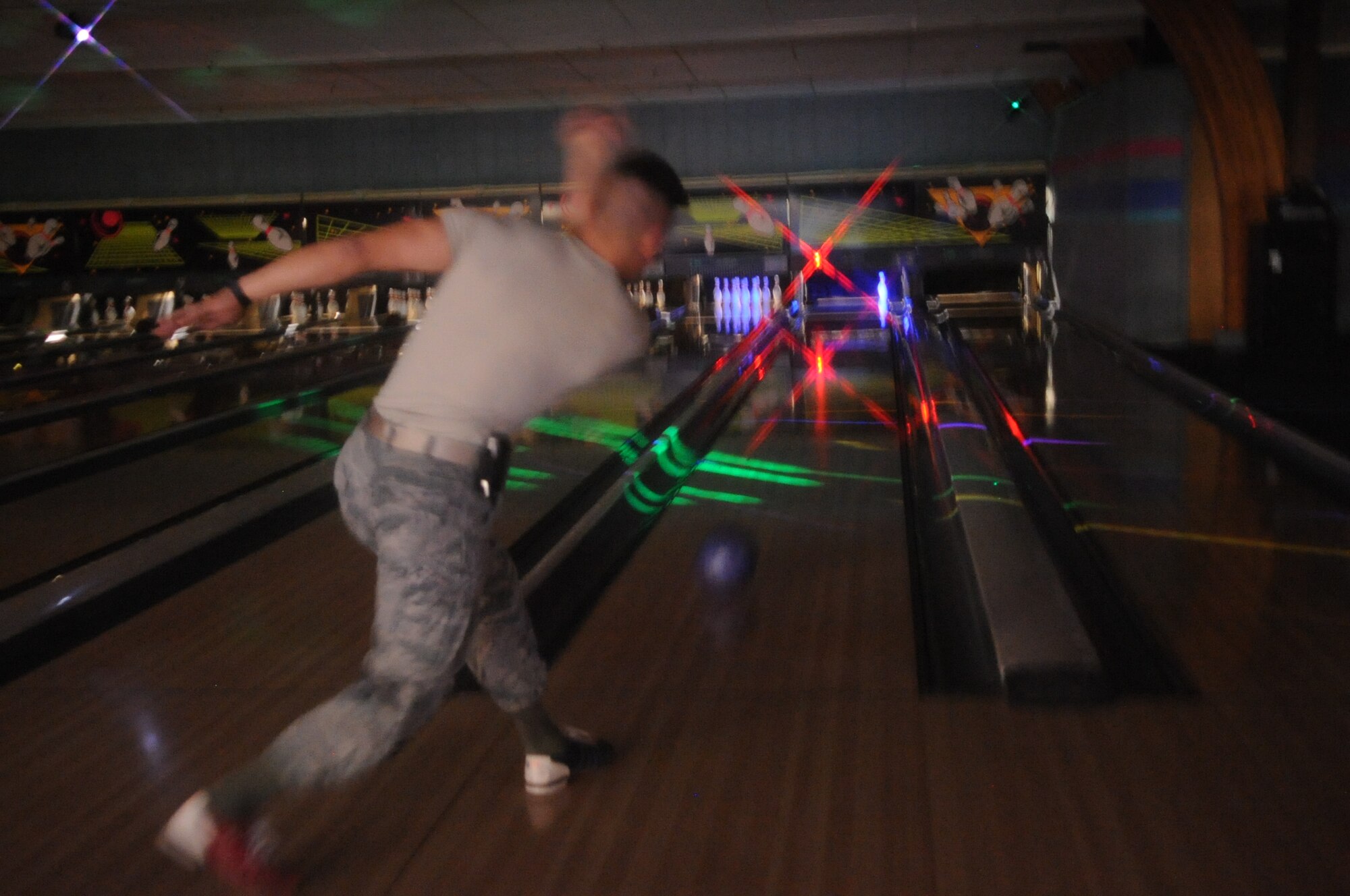 Airman 1st Class Joshua Hofmann, 319th Civil Engineer Squadron, looks for a strike during the 2012 Combined Federal Campaign Bowl-a-thon, Nov. 6, 2012 at the bowling alley on Grand Forks Air Force Base, N.D.  The CFC event was sponsored by the Grand Forks AFB Top 3, the installation’s professional military organization for enlisted service members in the top three pay grades of E-7 through E-9. All profits from the fundraiser were donated to the 319th Air Base Wing's Airman & Family Readiness Center through the CFC. (U.S. Air Force photo/ Staff Sgt. Amanda N. Grabiec)