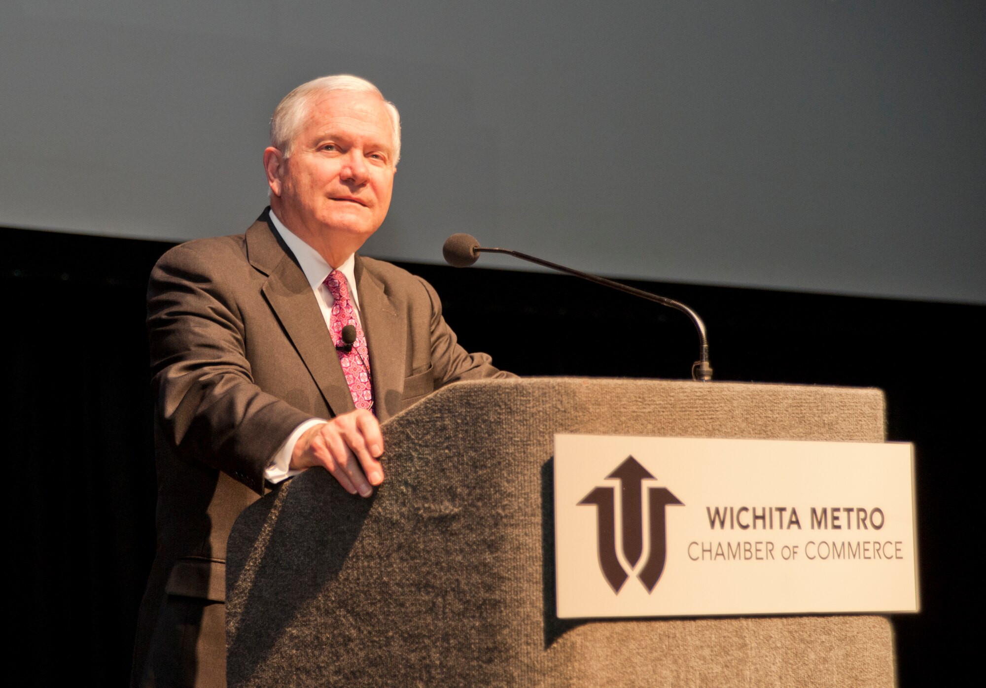 Former Secretary of Defense Robert Gates delivers a speech to McConnell Airmen and members of the Wichita Chamber of Commerce during the annual chamber meeting Nov. 12, 2012, Wichita, Kan. Gates, a Wichita native, took the Veterans Day weekend as a chance to speak face-to-face with the local community about his long career in public service and current national defense issues. (U.S. Air Force photo/Airman 1st Class Victor J. Caputo)