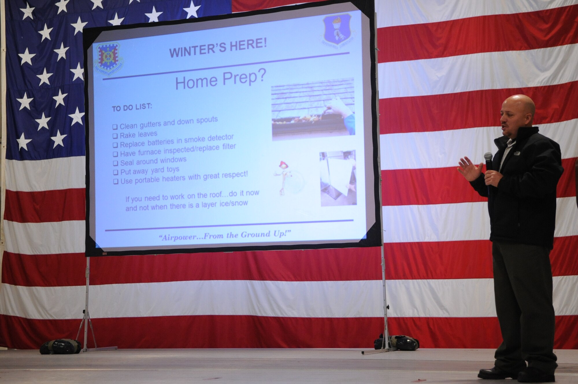 Andrew Swenson, 319th Air Base Wing Safety Office, addresses Airmen at the Grand Forks Air Force Base, N.D., Wing Safety Day on Nov. 5, 2012. Wing Safety Day featured speakers from the base and local community to promote safe practices for the coming winter. (U.S. Air Force photo/Staff Sgt. Amanda N. Grabiec)