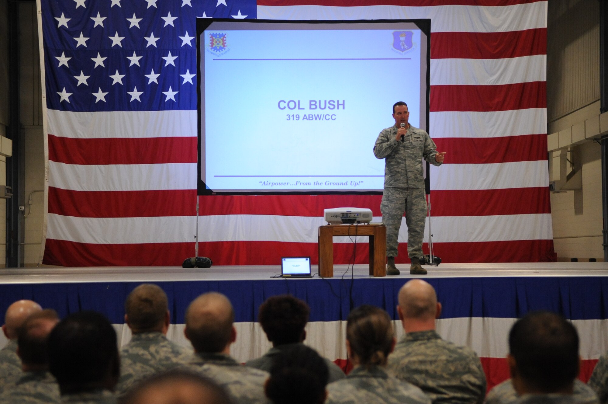 Col. Tim Bush, 319th Air Base Wing commander, addresses Airmen at the Grand Forks Air Force Base, N.D., Wing Safety Day on Nov. 5, 2012. Wing Safety Day featured speakers from the base and local community to promote safe practices for the coming winter. (U.S. Air Force photo/Staff Sgt. Amanda N. Grabiec)