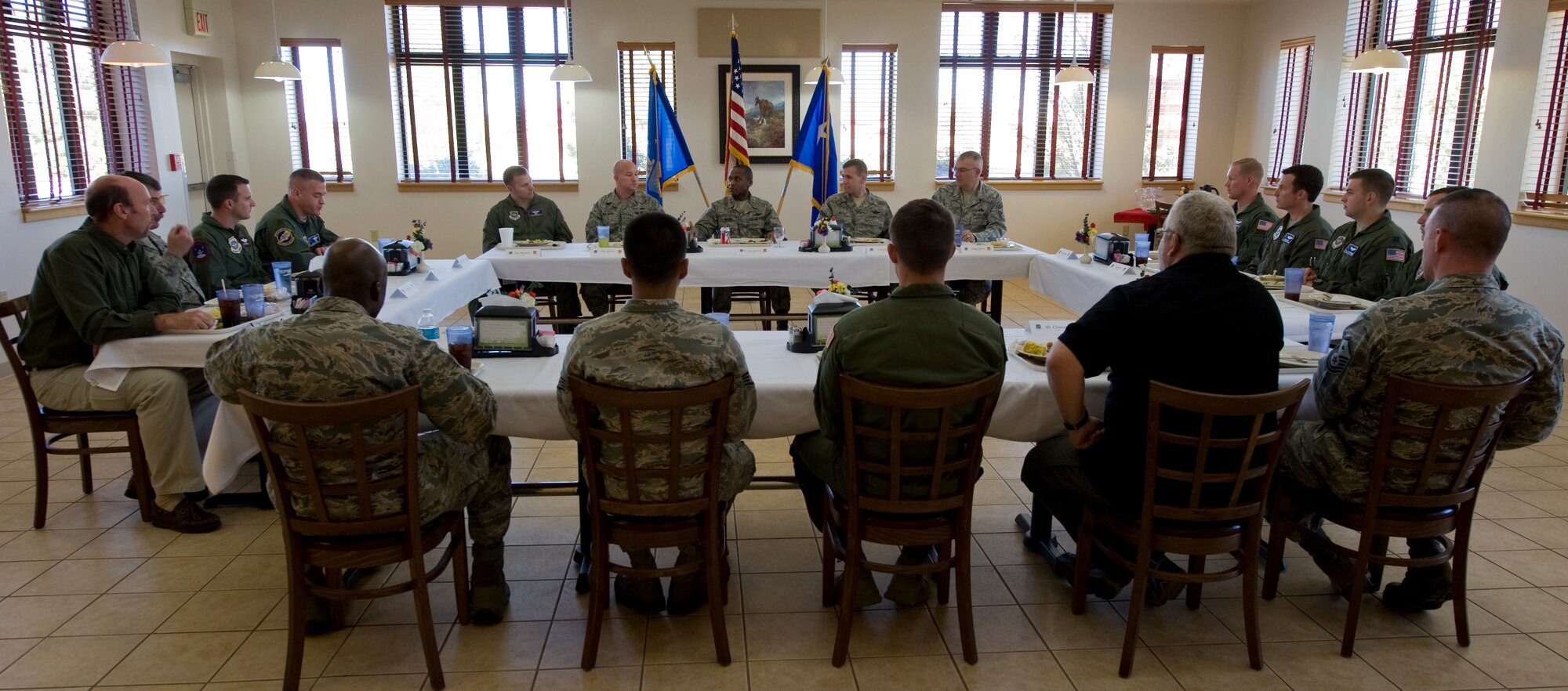 Lt. Gen. Darren McDew, 18th Air Force commander, eats lunch with 317th Airlift Group quarterly award winners Nov. 7, 2012, at Dyess Air Force Base, Texas. (U.S. Air Force photo by Airman 1st Class Jonathan Stefanko/ Released)