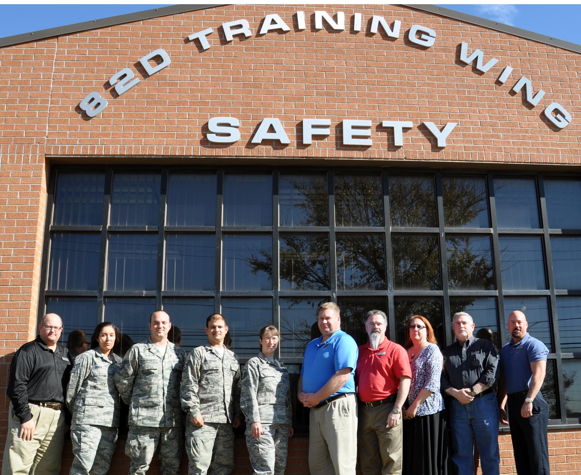 The 82d Training Wing Safety Office staff pose for a photo on November 11, 2012 after receiving three awards from AETC.  The Safety Office received the AETC To Promote Safety award and the AETC Ground Safety Excellence award.  Mr. Mark Schaffer, pictured far left, received the AETC Ground Safety Manager of the Year award.  (US Air Force Photo / Josh Wilson)