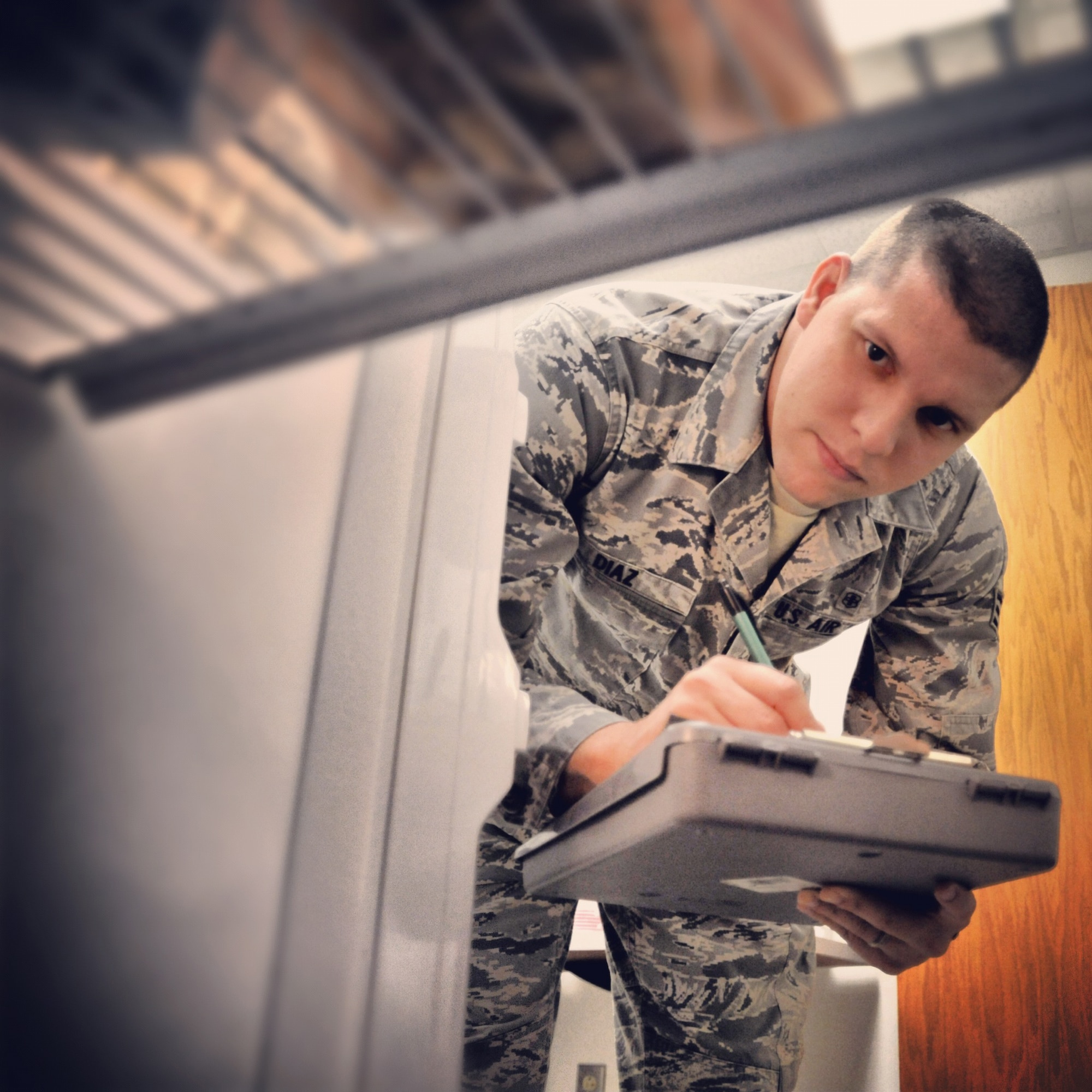 Senior Airman Osniel Diaz, 42nd Medical Group public health professional, inspects kitchen equipment at Maxwell Air Force Base, Nov. 6. Diaz started his Air Force career without knowing how to speak English. (U.S. Air Force illustration by Senior Airman Christopher Stoltz)