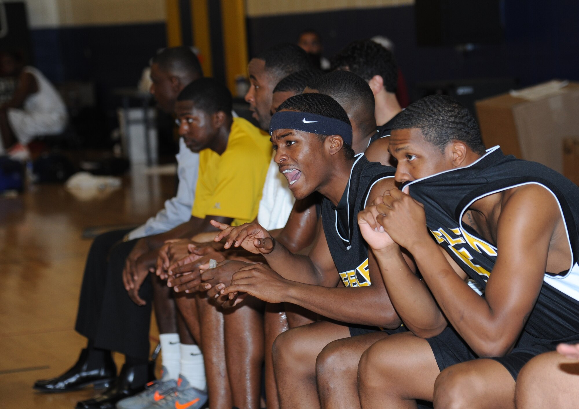Justin Callender, Keesler, cheers on his teammates from the sideline during a varsity basketball game against Eglin Air Force Base, Fla., Nov. 10, 2012, at the Blake Fitness Center, Keesler Air Force Base, Miss.  Keesler defeated Eglin, 80-71.  The women’s varsity team also defeated Eglin, 83-48.  (U.S. Air Force photo by Kemberly Groue)