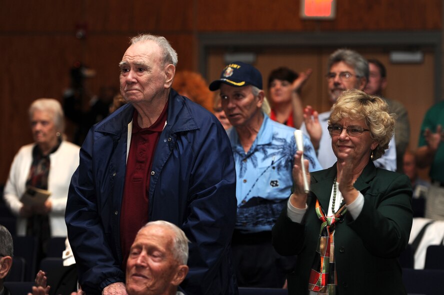 Audience-members stand and clap during a U.S. Air Force Heritage of America Band performance of the Armed Services Medley at Jesse Carson High School in China Grove, N.C., Nov. 9, 2012. Veterans were encouraged to stand when they heard the band play their service-specific song. (U.S. Air Force photo/Staff Sgt. Charles Broadway/Released)