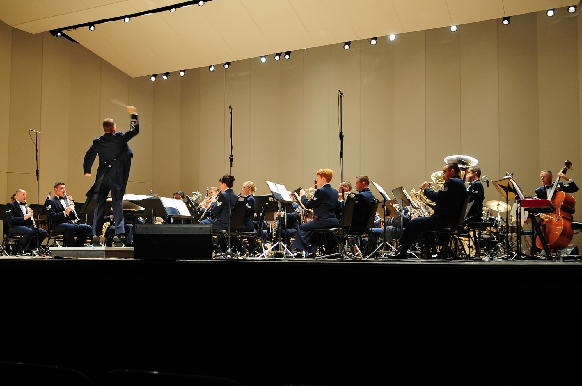 U.S. Air Force Lt. Col. Jeffrey Warner, USAF Heritage of America Band commander, conducts band members during a performance at the War Memorial Auditorium in Greensboro, N.C., Nov. 10, 2012. The band, based out of Joint Base Langley-Eustis, Va., has represented the Air Force with musical and military distinction since 1941. Warner is a native of Florida. (U.S. Air Force photo/Airman 1st Class Aubrey White/Released)