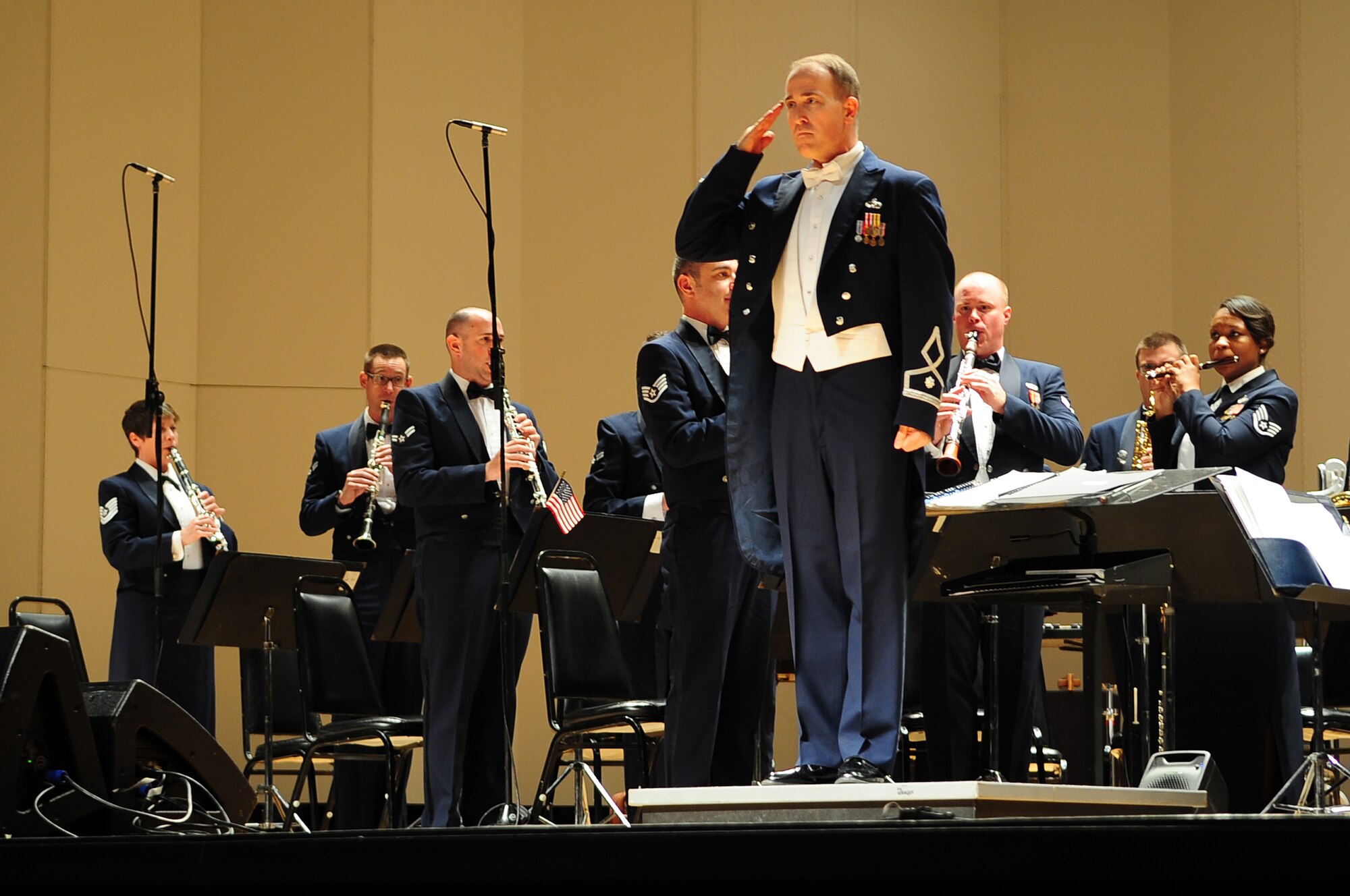 U.S. Air Force Lt. Col. Jeffrey Warner, USAF Heritage of America Band commander, salutes the audience during a performance at the War Memorial Auditorium in Greensboro, N.C., Nov. 10, 2012. Many veterans and their families came out to enjoy the Veteran’s Day-themed concert. Warner is a native of Florida. (U.S. Air Force photo/Airman 1st Class Aubrey White/Released)