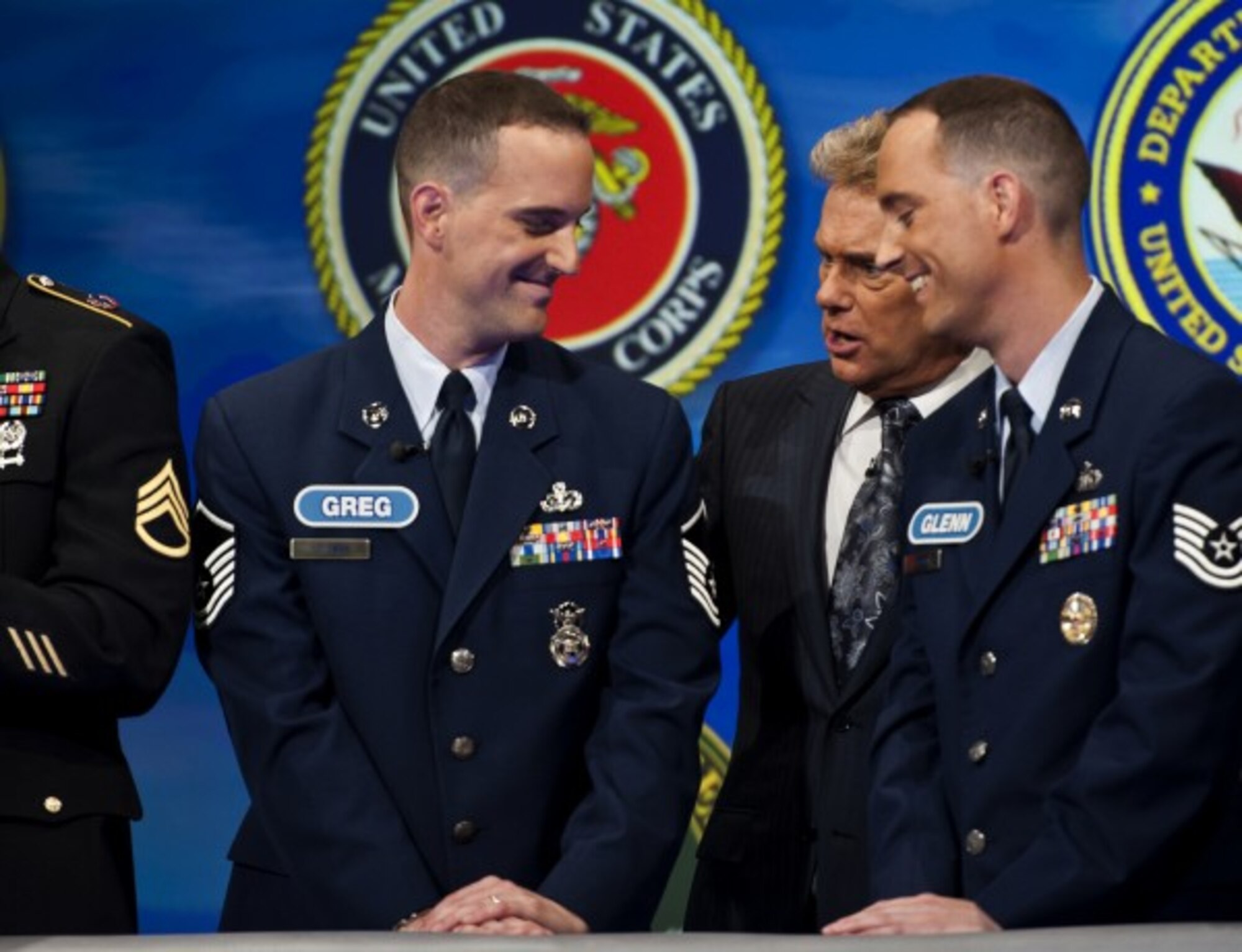 Pat Sajak, the 30-year host of the “Wheel of Fortune,” congratulates Greg and Glenn for coming on the show. The twin brothers plan to take a trip with the money they earned.(U.S. Air Force photo/Tech. Sgt. Bennie J. Davis III)

