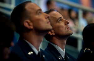 Brothers Tech. Sgt. Glenn (left) and Master Sgt. Greg Coleman watch other military contestants participating on “Wheel of Fortune” on overhead monitors while waiting for their opportunity to compete on the show. (U.S. Air Force photo/Tech. Sgt. Bennie J. Davis III)
