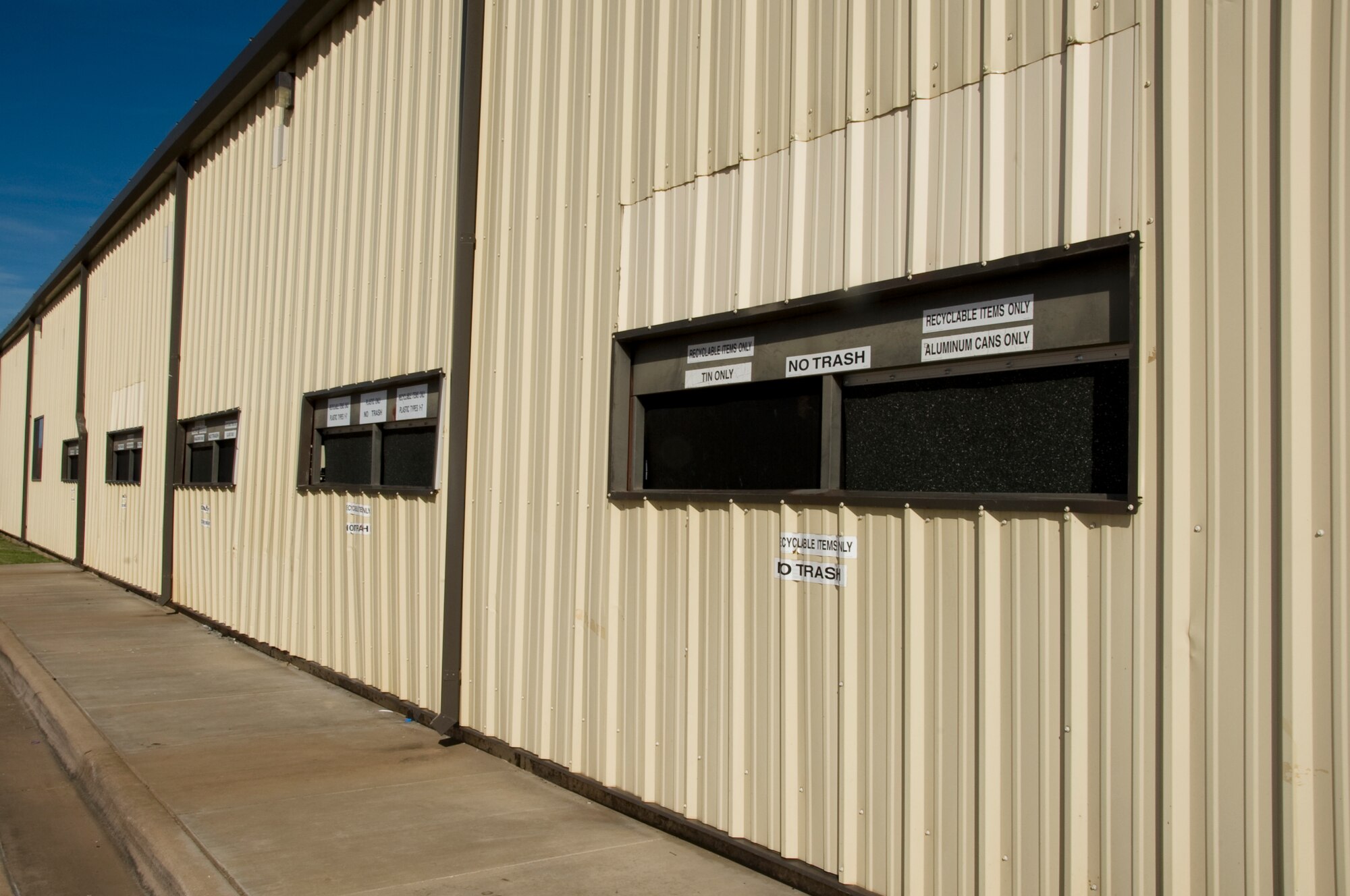 Convenient drop-off drive-up windows are located at the front of the Sheppard AFB Recycle Center. Each window is specific for a recyclable material. (U.S. Air Force photo by Frank Carter)
