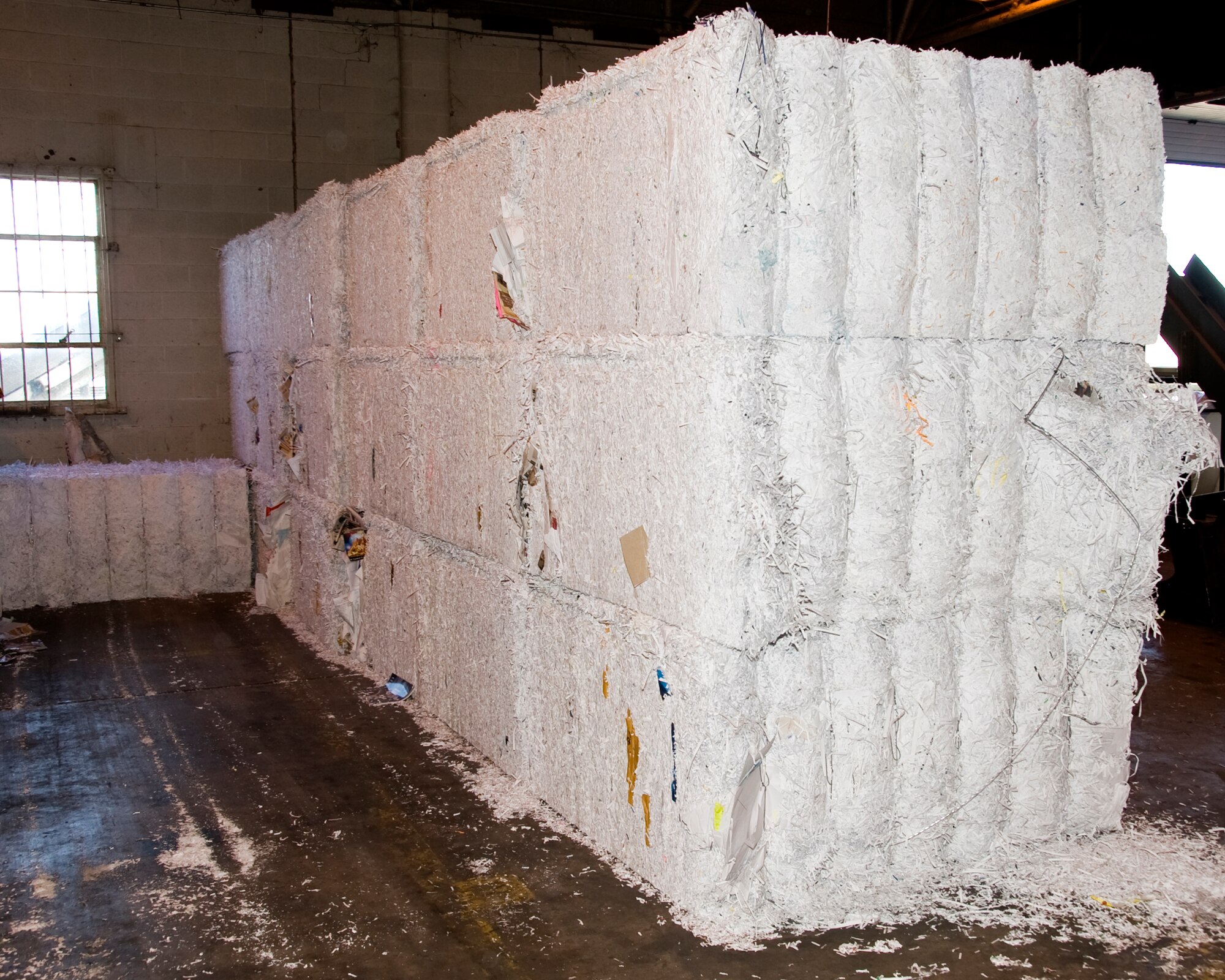 Bales of shredded paper are ready for recycle vendor pick-up from the Sheppard AFB Recycle Center. Each bale weighs approximately 1500 to 1700 lbs. (U.S. Air Force photo by Frank Carter)