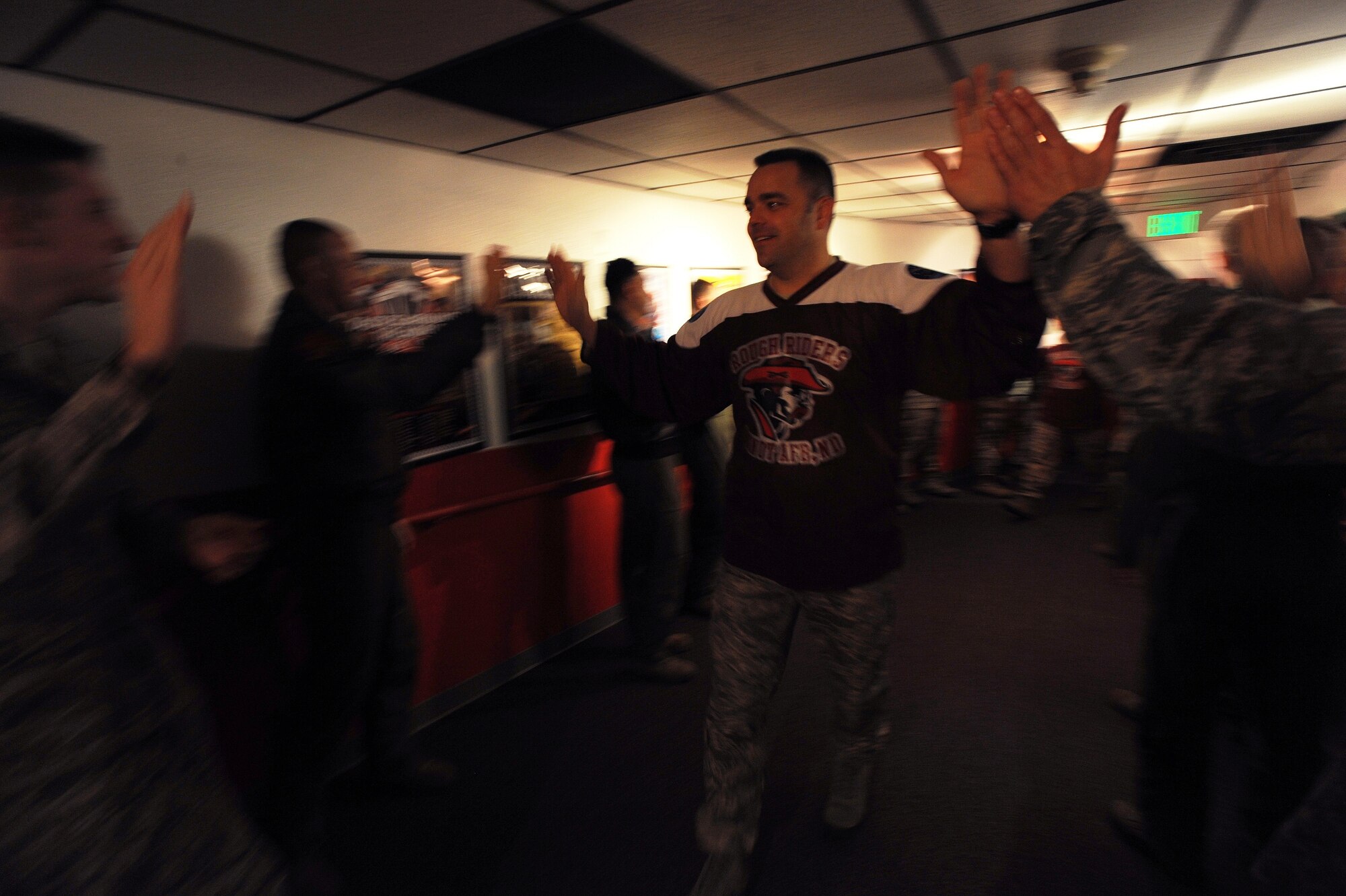 MINOT AIR FORCE BASE, N.D. -- Chief Master Sgt. Paul Tranetzke, 91st Missile Wing command chief, is greeted by families and Airmen from the 91st MW following the closing of the Global Strike Challenge at Barksdale AFB, La. The competition is an annual event where the top security forces, maintainers, and missile and bomber crews compete to be recognized as the "best of the best" in their fields. It began in July, and ran through the summer. (U.S. Air Force photo/Senior Airman Jose L. Hernandez)