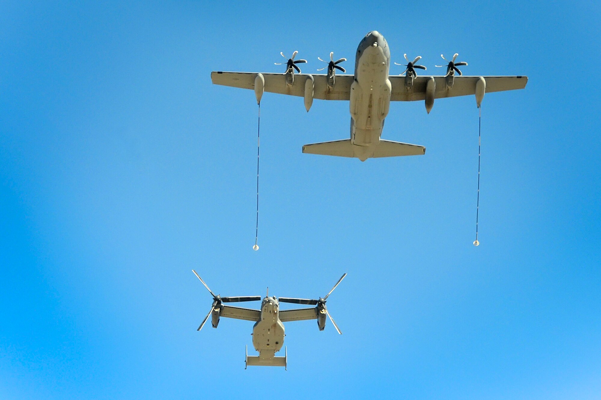 An MC-130J Commando II and a CV-22 Osprey perform a fly over the Texas Tech University stadium in Lubbock, Texas, Nov. 9, 2012. More than 500 members from the 27th Special Operations Wing at Cannon Air Force Base, N.M., attended the game in honor of Military Appreciation Day. (Courtesy photo/Steven Leija)