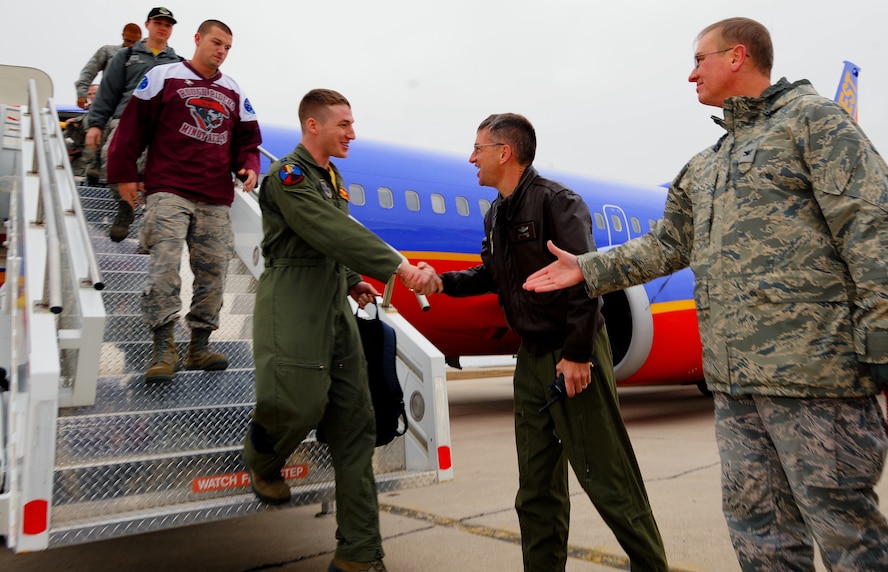 MINOT AIR FORCE BASE, N.D. -- Members of Team Minot arrive here from Barksdale AFB, La., where they gathered for the results of this year's third annual Global Strike Challenge. The competition is an annual event where the top security forces, maintainers, and missile and bomber crews compete to be recognized as the "best of the best" in their fields. It began in July, and ran through the summer. (U.S. Air Force photo/Senior Airman Jose L. Hernandez)
