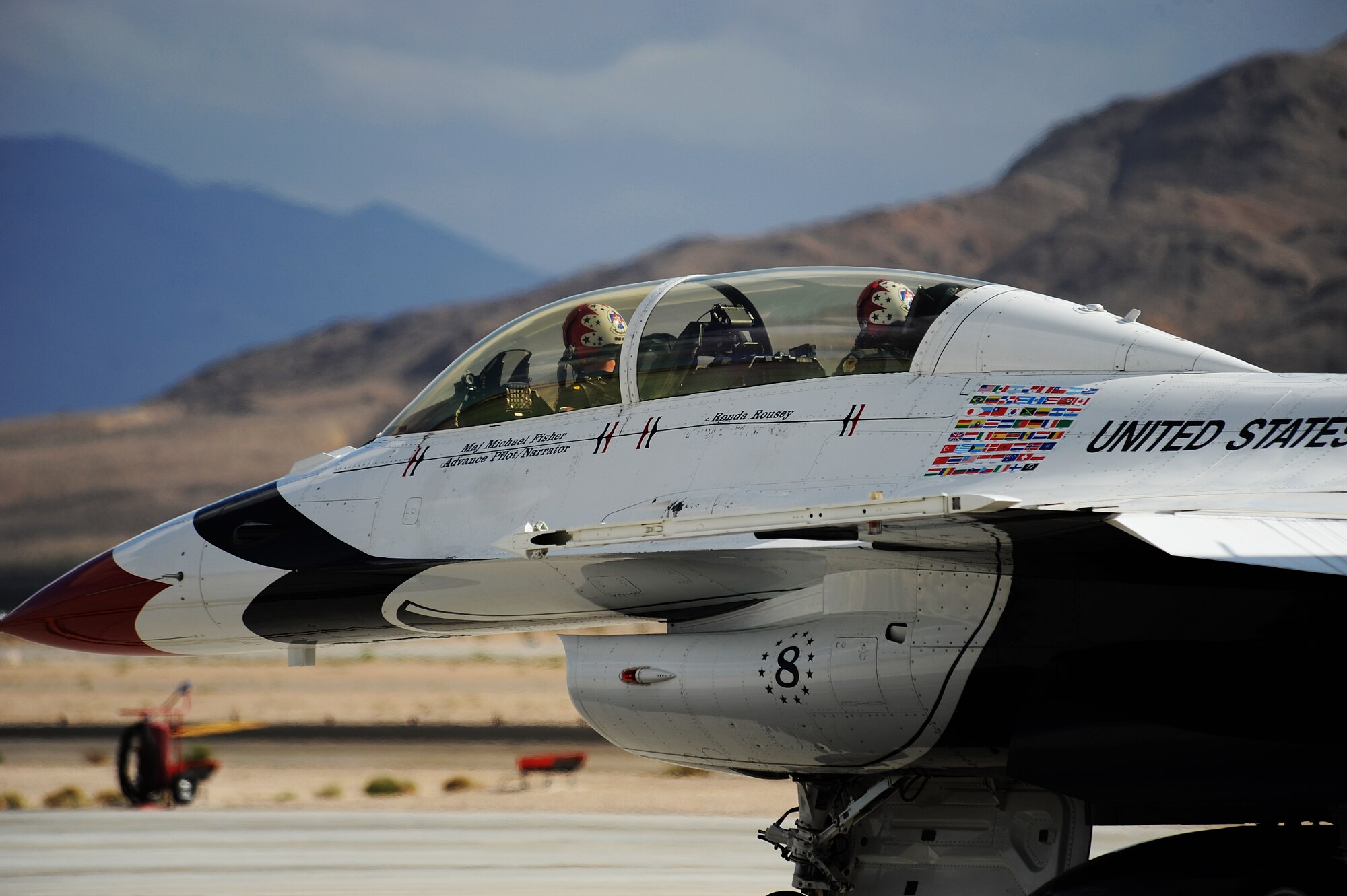 Major Michael Fisher, Thunderbird 8, Advance Pilot/Narrator and mixed martial artist champion, Ronda Rousey, taxis out for a F-16 Fighting Falcon flight at Nellis Air Force Base, Nev., Nov. 9, 2012.
(U.S. Air Force photo/Staff Sgt. Larry E. Reid Jr., Released)