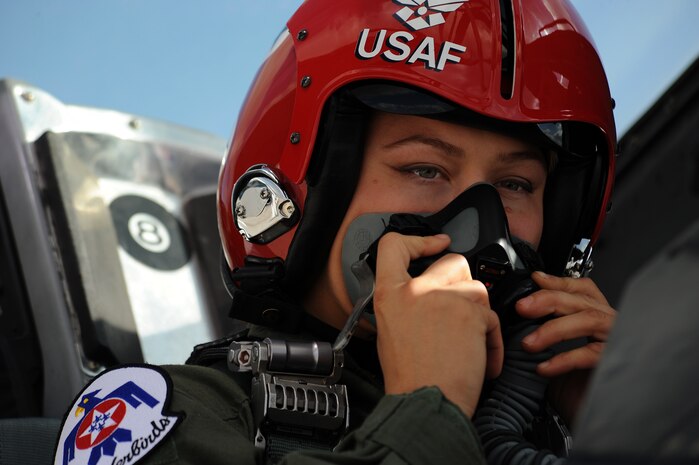 Mixed martial artist champion, Ronda Rousey, adjusts her flight mask in preparation for her Thunderbird F-16 Fighting Falcon flight at Nellis Air Force Base, Nev., Nov. 9, 2012.(U.S. Air Force photo/Staff Sgt. Larry E. Reid Jr., Released)